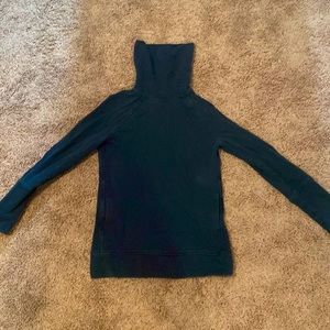 it is too small for me, it is a dark tree/ blue green and it is a 2